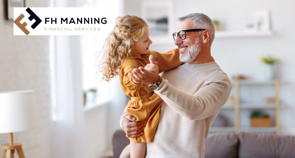 Grandfather holding grand daughter - FH Manning Company director pension blog