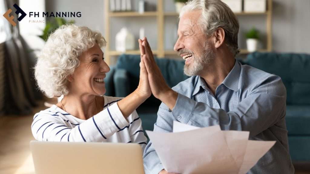 Retired couple high fiving