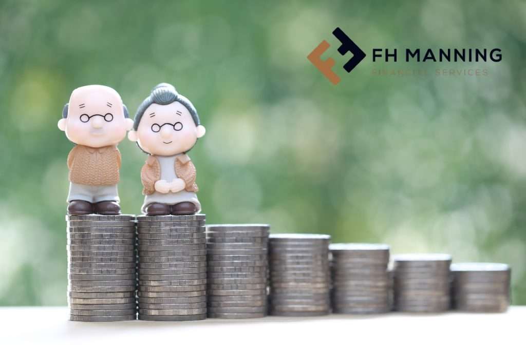 FH Manning Financial services blog image. Old couple standing on pile of coins