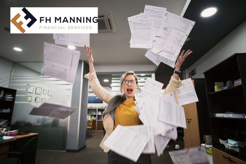 Business woman throwing documents in to the air