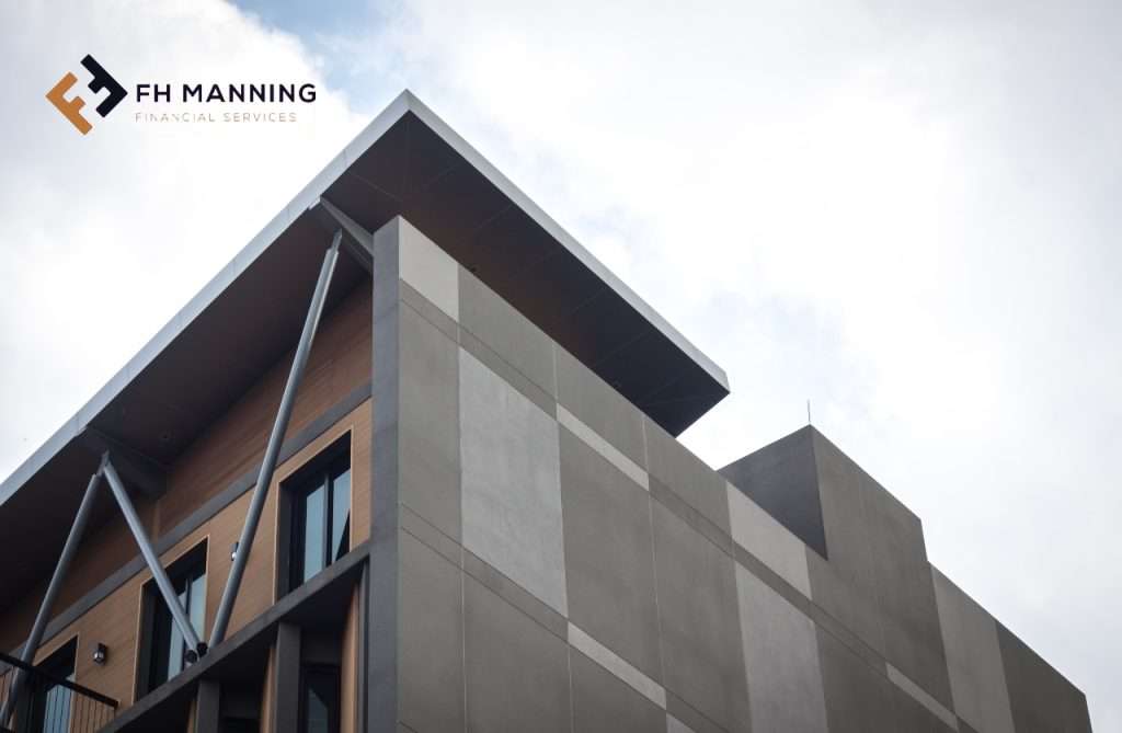 Commercial building image branded with FH Manning logo