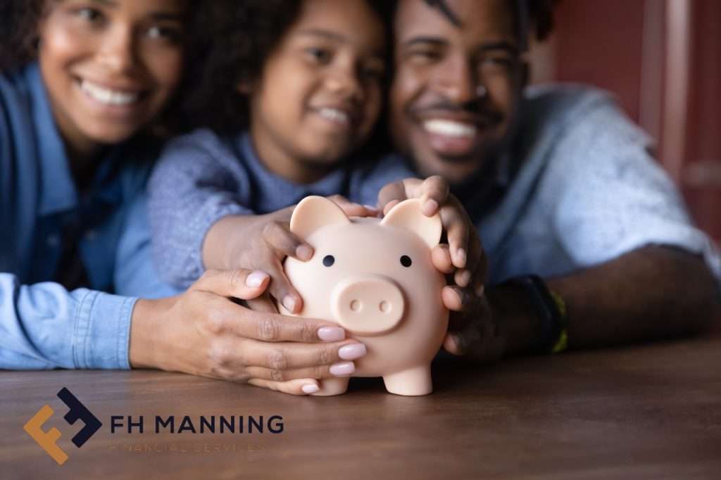 Family holding a piggy bank