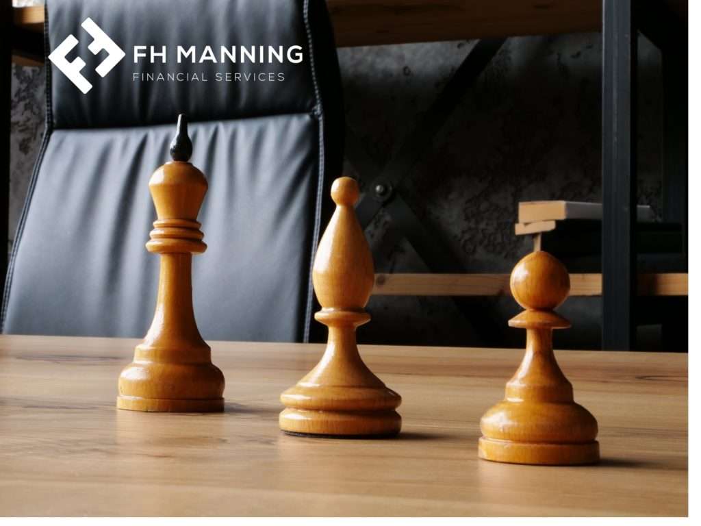 Three chess pieces on desk